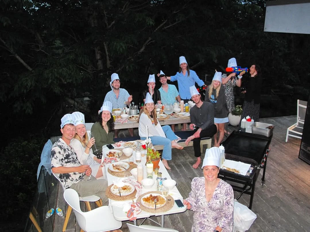Guests gathered around an outdoor hibachi dinner table